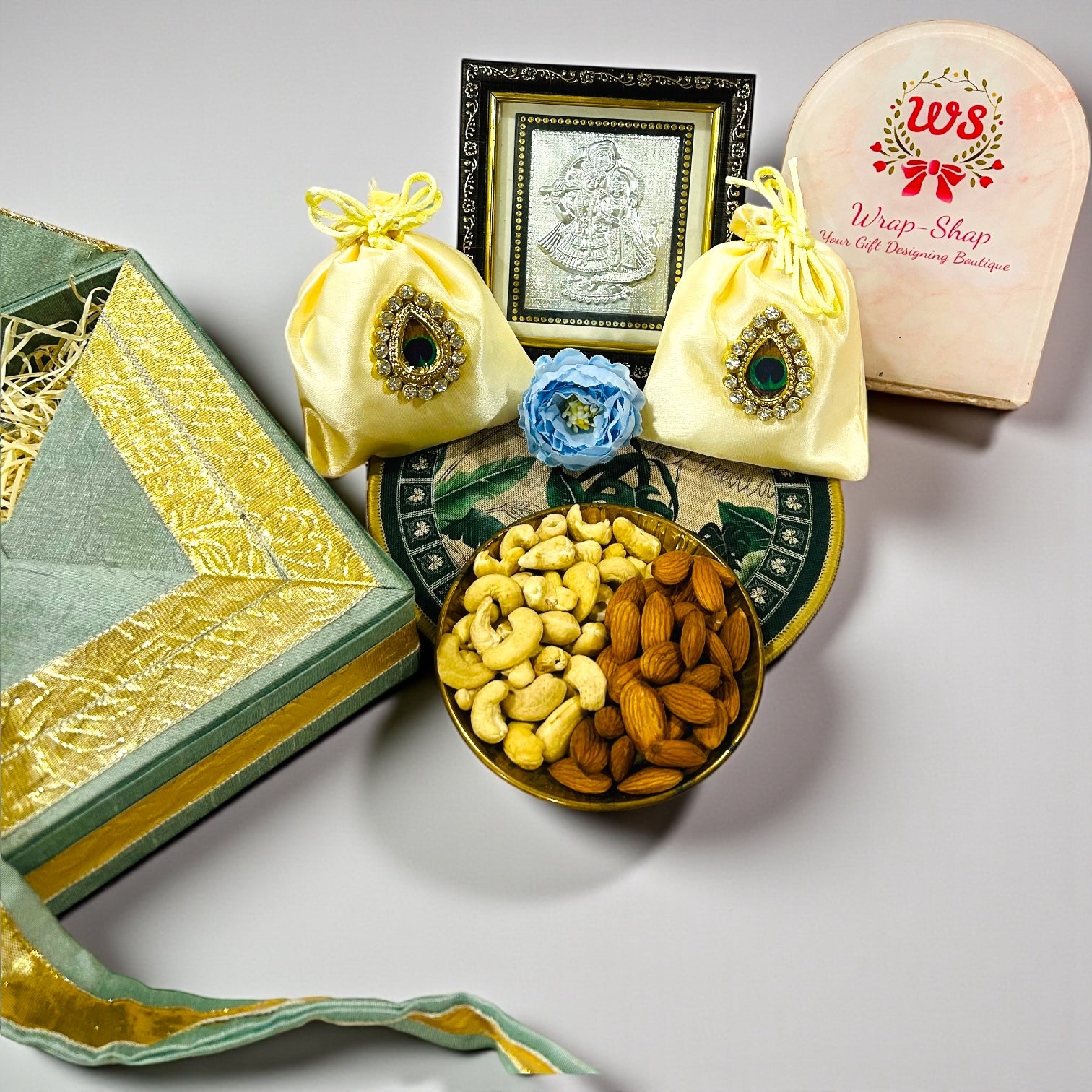 Wedding return favour with Ganesh silver frame, dry fruits and multipurpose mat in gota ribbon gift box