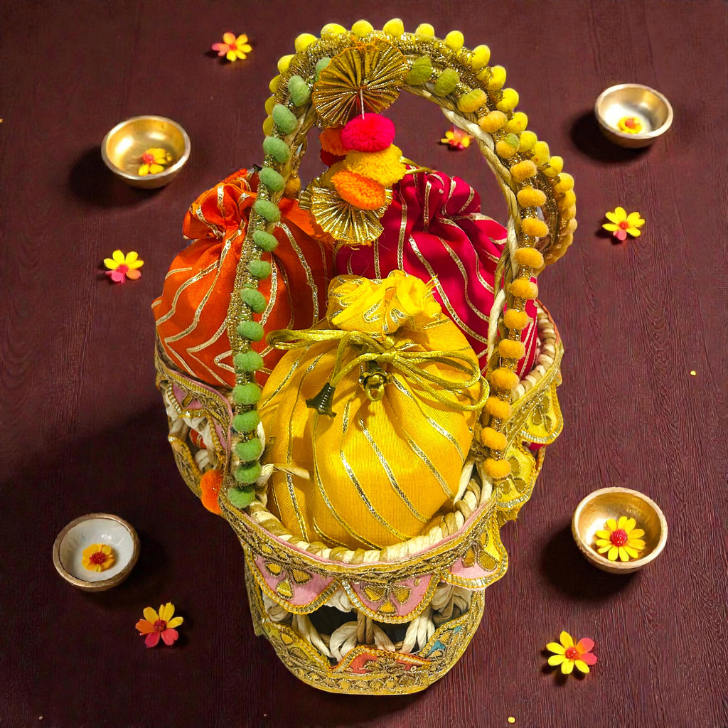 Lohri themed jute basket hamper with colourful gota potli and traditional snacks