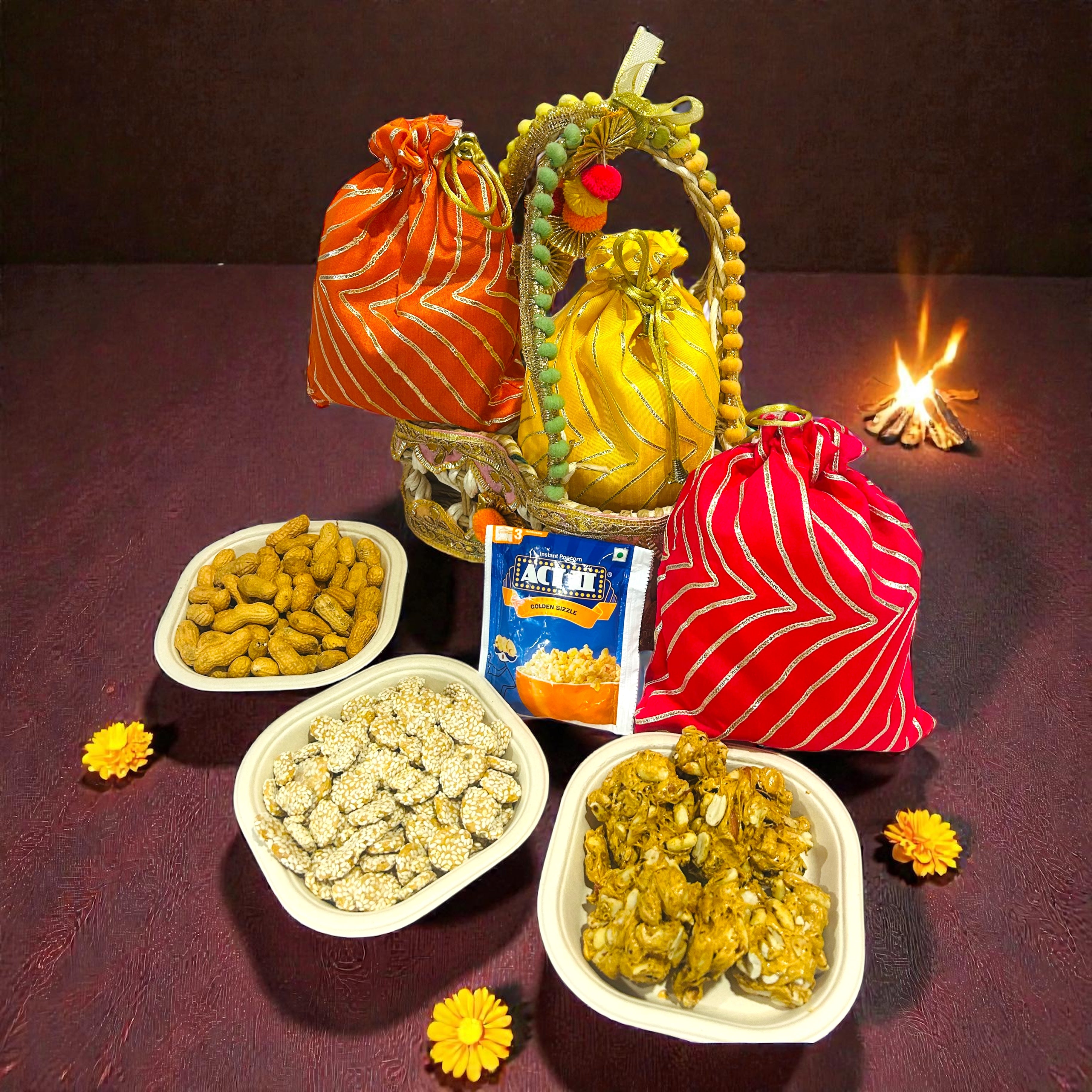 Lohri gift hamper in jute basket with colourful gota potli containing revdi, peanut chikki and moongfali