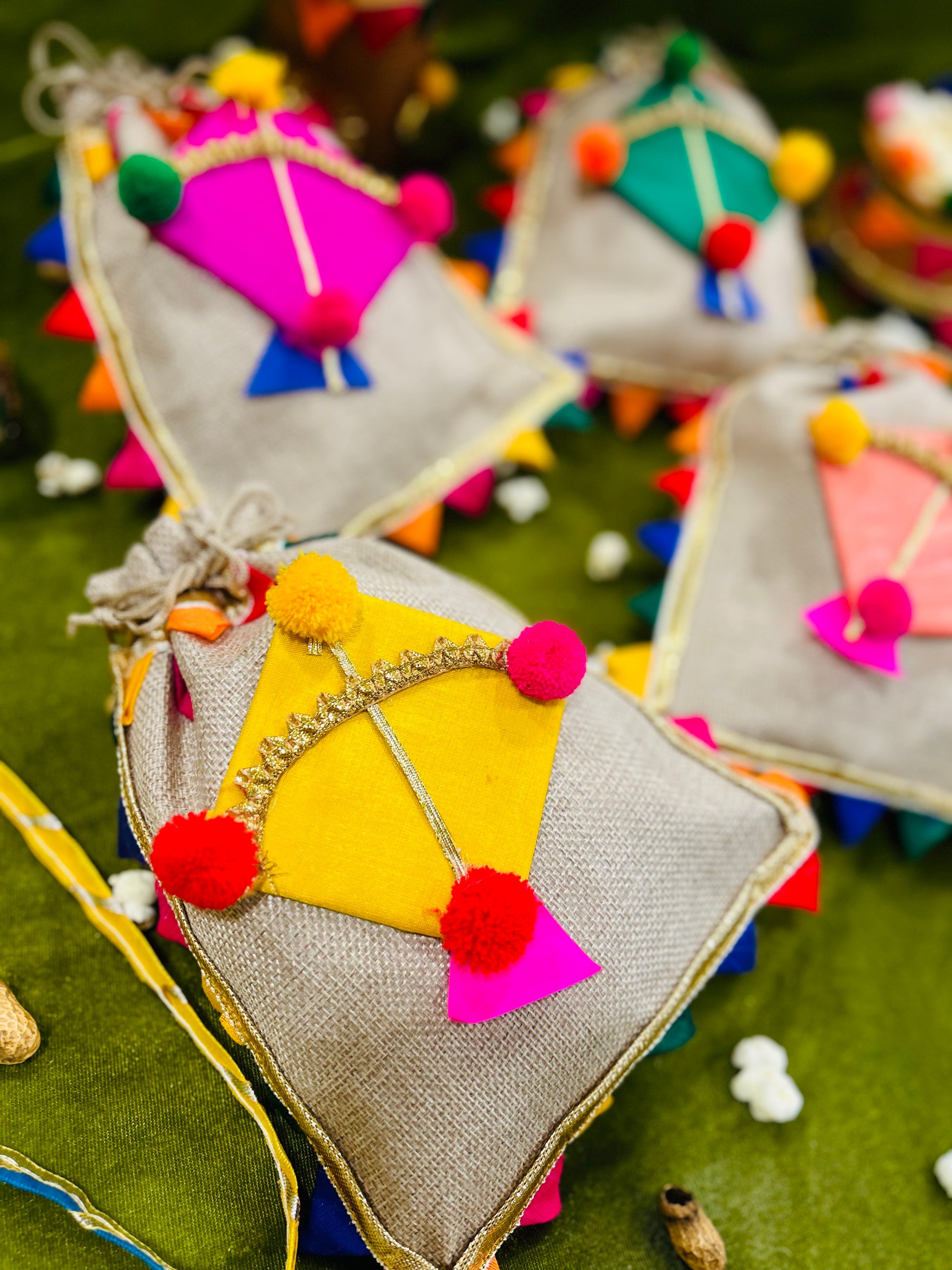 Jute decorated potli with kite design and multicolor lace for Lohri gifting, size 7x9 inch.