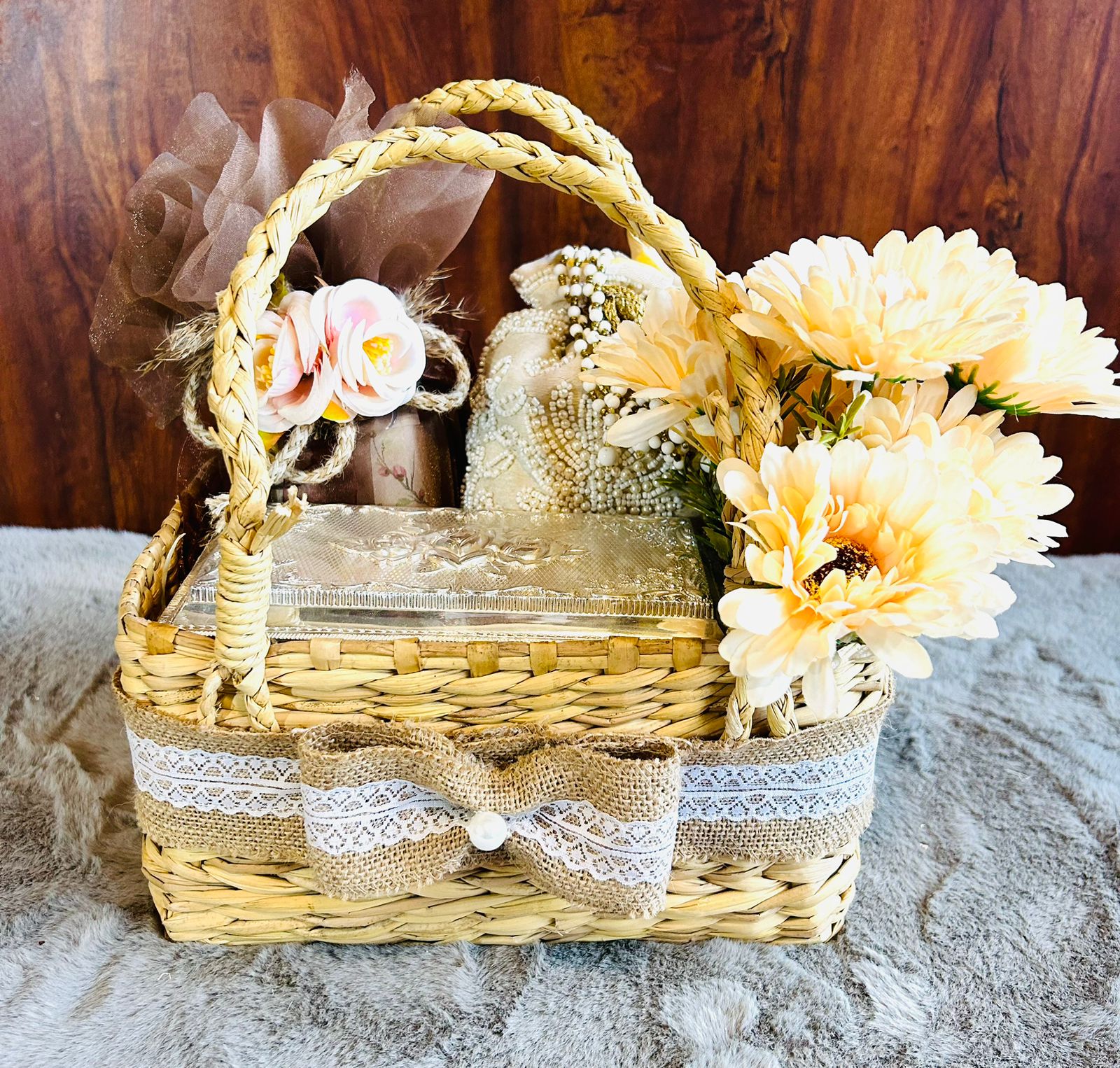 Luxury Kauna Diwali gift basket with handmade chocolates, cashews, oil diffuser, and artificial flower