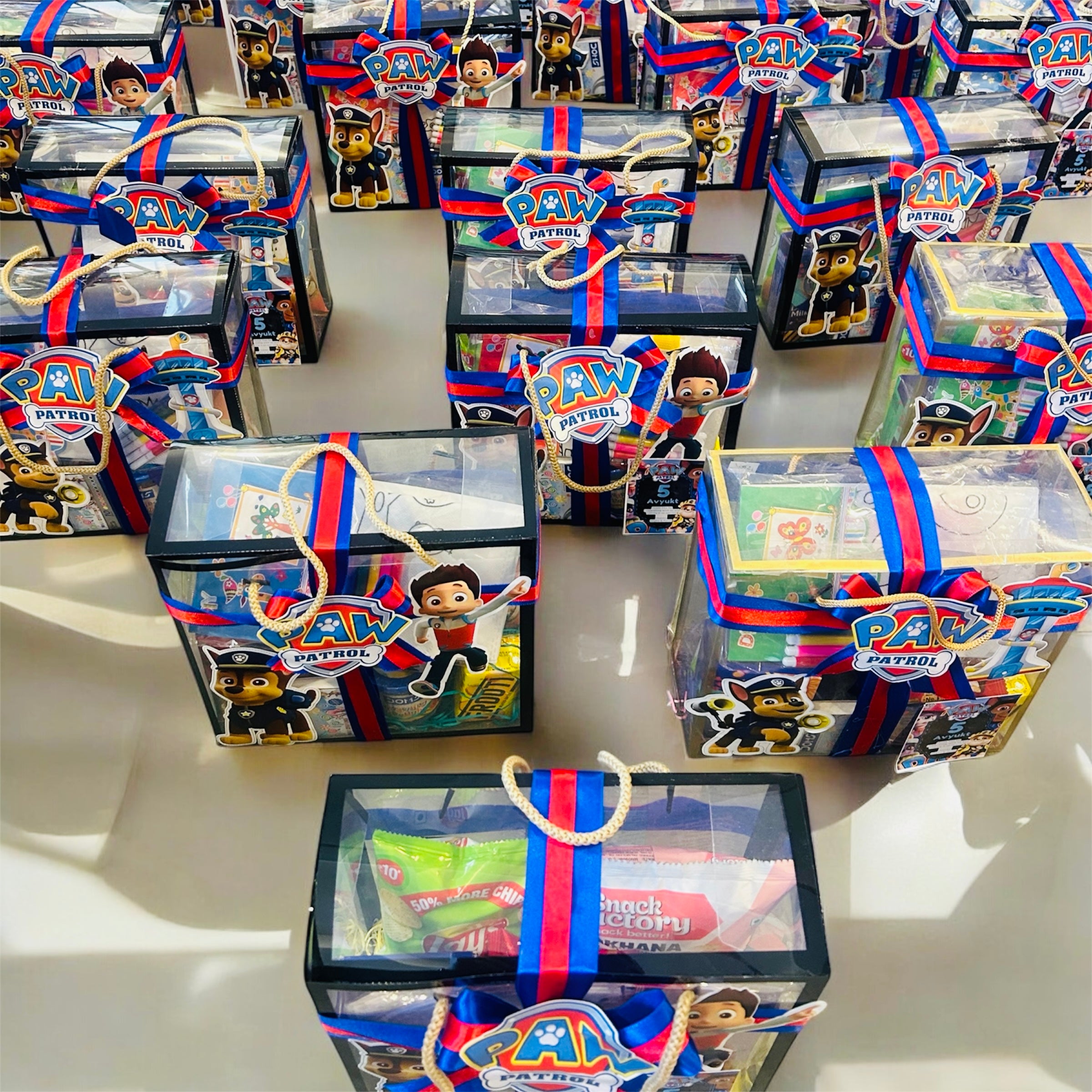 Customized birthday party favor hamper with coloring kit and snacks