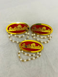 Elegant red & golden Ladkewale brooch featuring laser-cut acrylic “Ladkewale” text and pearl chain, perfect for groomsmen, groom’s family, and wedding guests at mehendi, sangeet, and wedding ceremonies.
