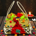 Premium Lohri gift hamper in a large rafia basket with revdi, chikki, moongfali and popcorn in jute gift boxes.