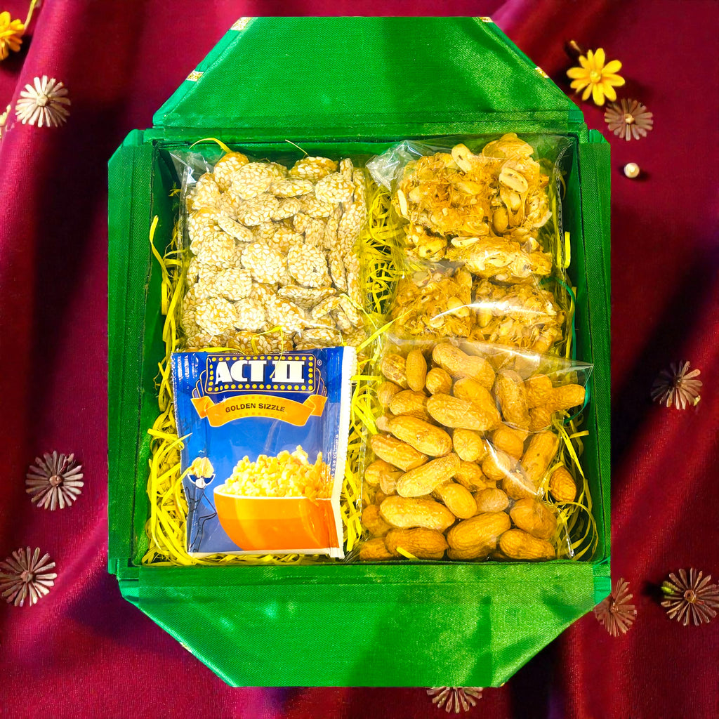 Festive Lohri hamper in a colourful gota-decorated gift box with traditional snacks.