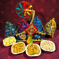 Lohri gift hamper in decorated MDF basket with gajak, revdi, moongfali and popcorn.