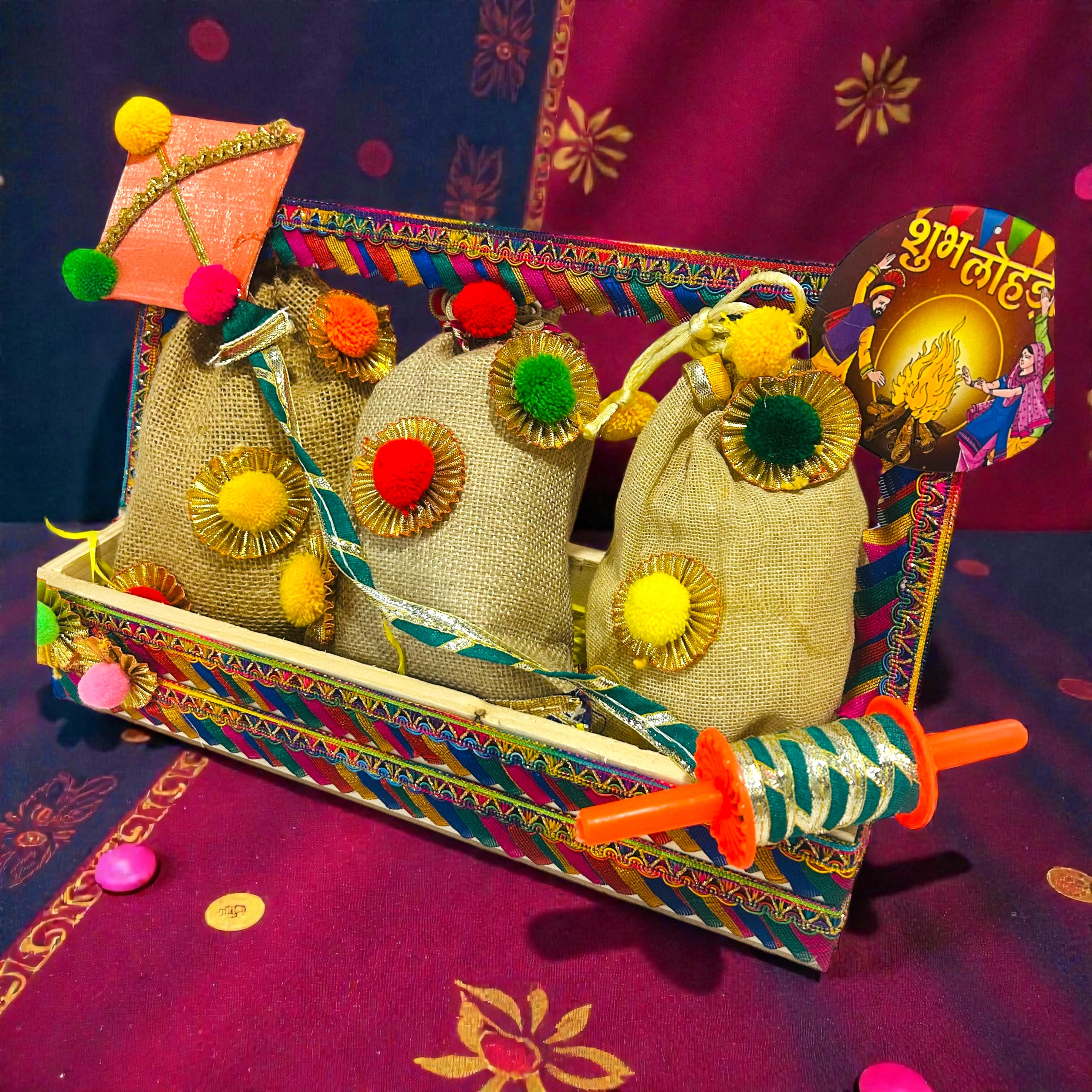Lohri themed pine basket hamper with traditional snacks packed in jute potlis