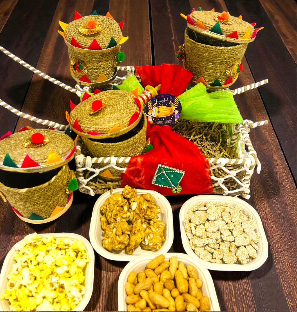 Lohri themed rafia basket hamper with traditional snacks packed in jute gift boxes.