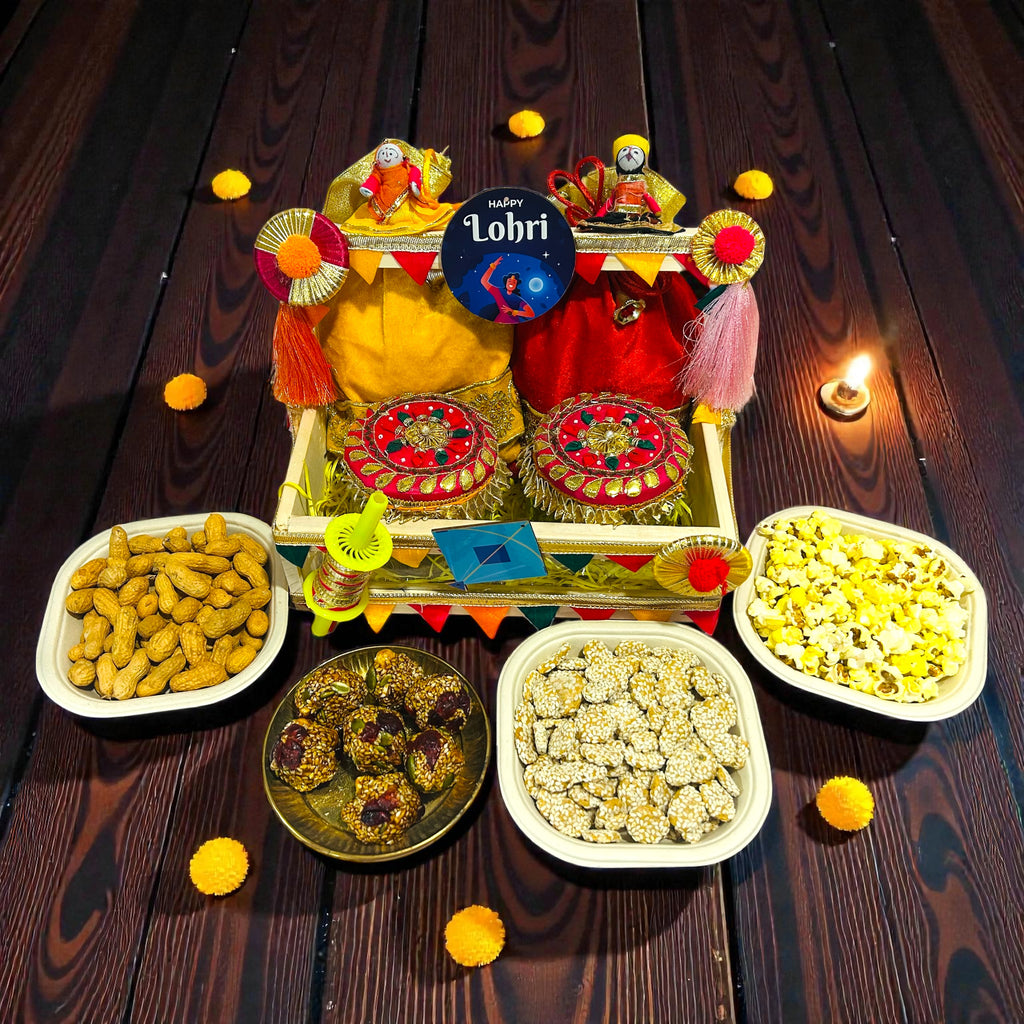 Lohri themed pine basket hamper with velvet potlis, popcorn, moongfali and traditional sweets.