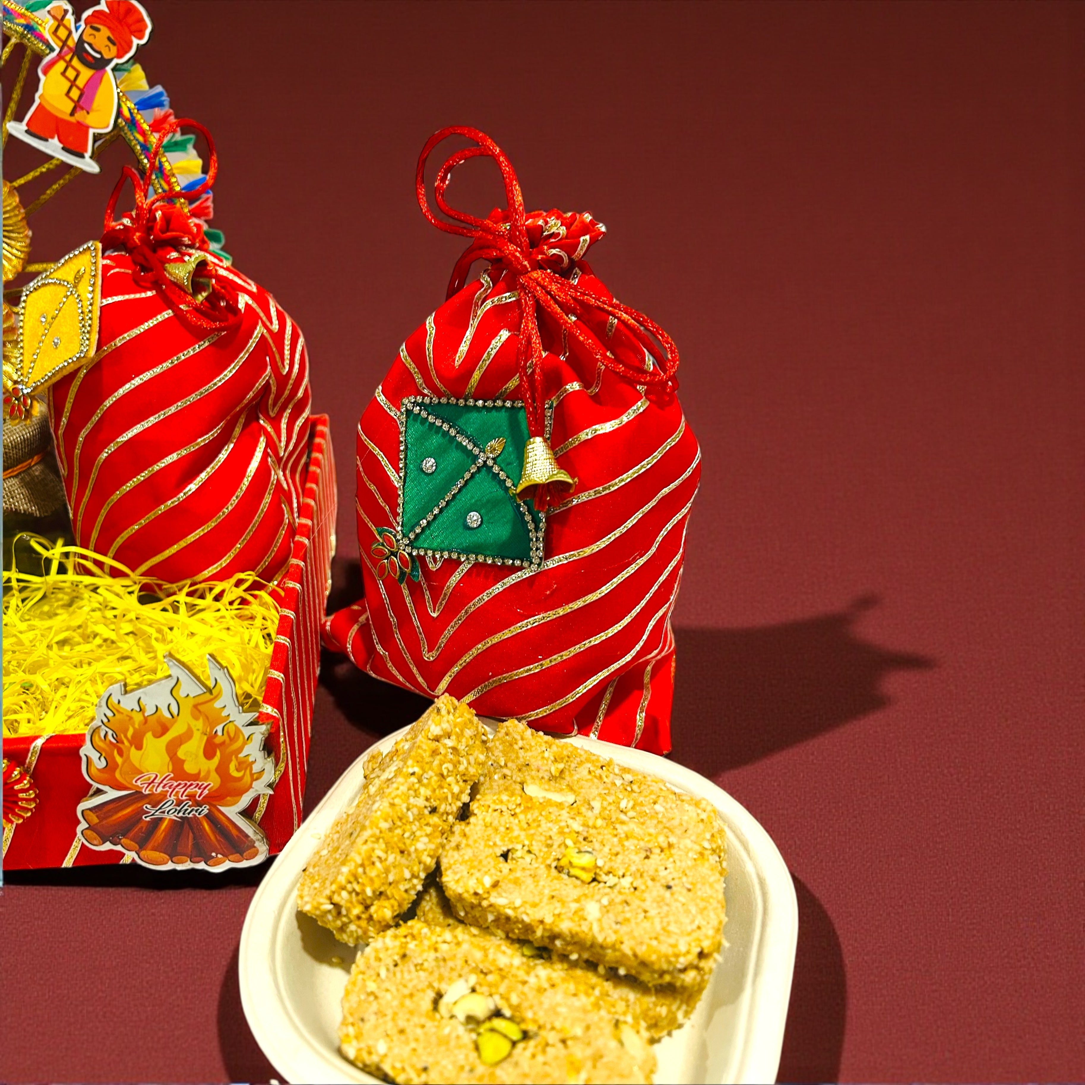 Gota Leheriya themed Lohri tray hamper with traditional festive sweets and snacks.