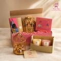 Shop the Luxury Candle Gift Hamper by Wrap Shap featuring two scented candles, a decorative bird cage tea-light holder, Kaju Katli, incense cones, a potli batwa bag, and premium gift box packaging. Perfect for Diwali, birthdays, housewarming, weddings, corporate gifting, and festive celebrations.
