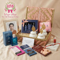 rand Celebration Hamper by Wrap Shap featuring a Premium AD Rakhi, decorative dry fruit jars filled with cashews, almonds and raisins, gourmet chocolates, Gulab Kaju Katli, Kimirica Gentlemen Gift Set, The Man Company EDP, personalized photo frame, roli chawal, handwritten premium greeting card, and a luxury woven gift box for Raksha Bandhan.