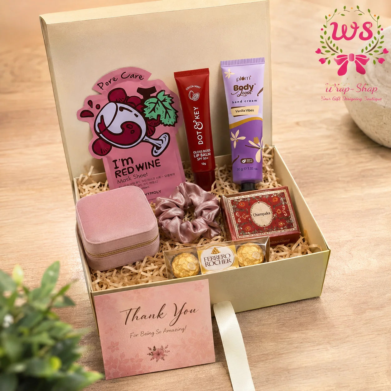 Luxury Self-Care Gift Hamper by Wrap Shap featuring mini hand cream, lip balm, herbal soap bar, sheet mask, jewellery organiser, scrunchies, Ferrero Rocher chocolates, thank-you card, and a premium gift box for birthdays, festive gifting, and wellness gifts.