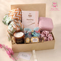 Luxury Women’s Gift Hamper by Wrap Shap featuring a printed silk-blend stole, Plum mini perfume set, jewellery pouch, designer hair pin, scrunchies, scented candle, Ferrero Rocher chocolates, thank-you card, and premium gift box packaging.