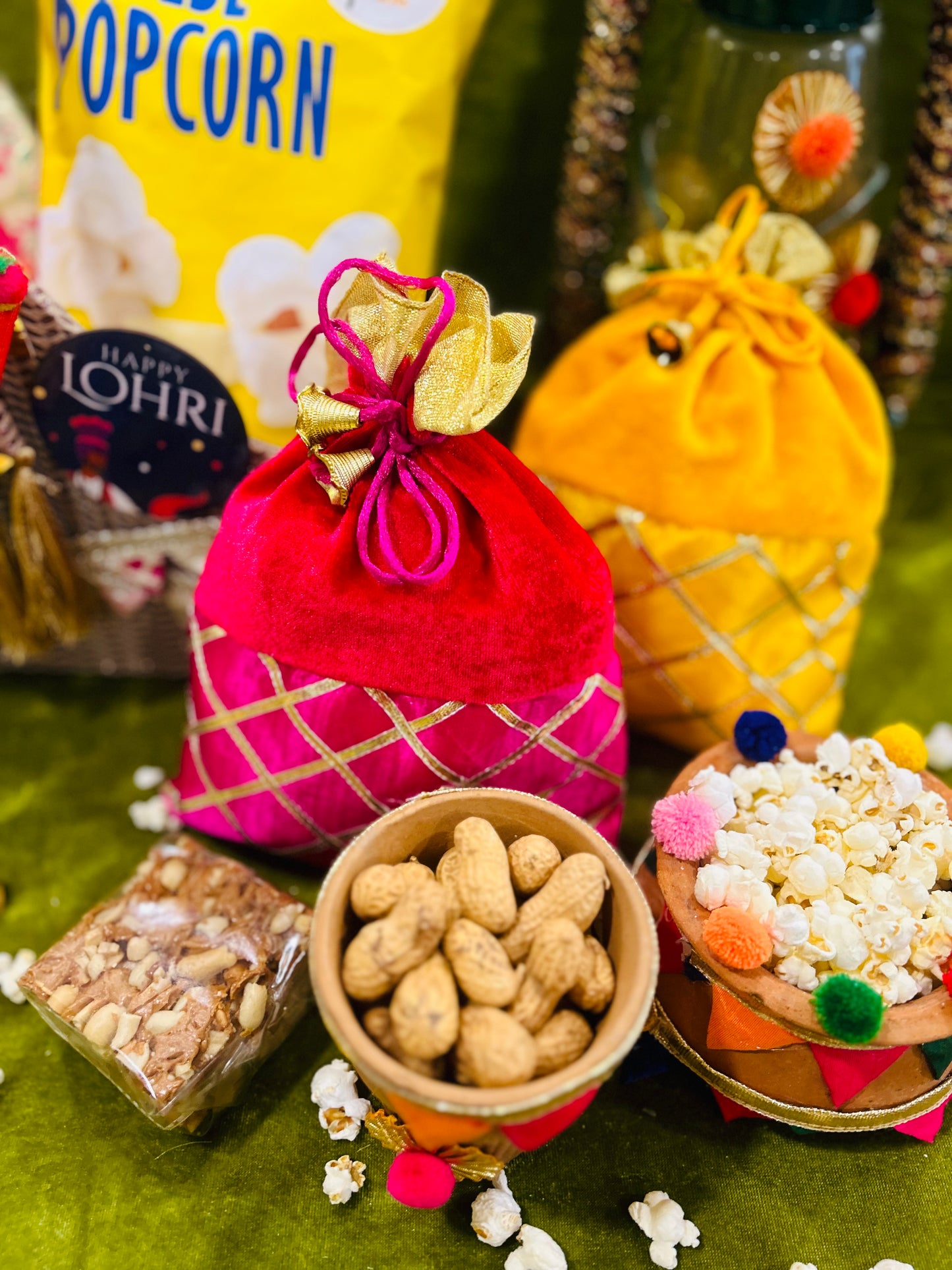 Festive Lohri and Makar Sankranti hamper with traditional sweets in a decorated basket.