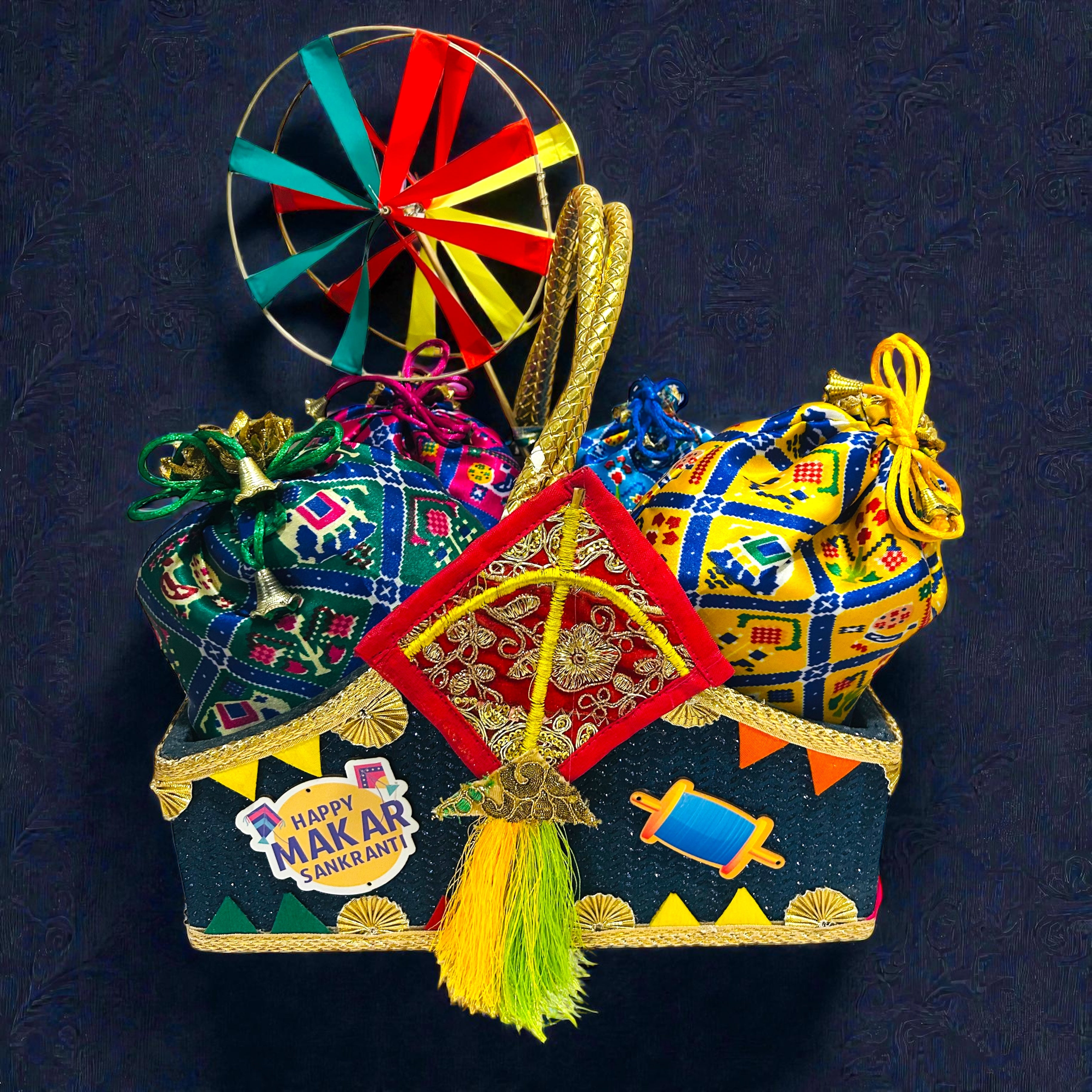 Traditional Lohri and Makar Sankranti hamper with patola potli and festive eatables.