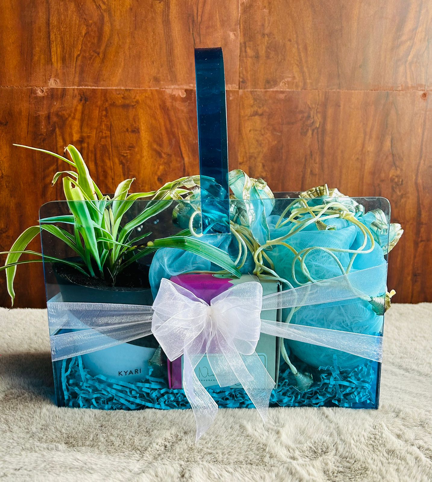 Premium neon acrylic Diwali hamper with coated almonds, cashews, incense cones, plant, and tissue potlis