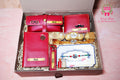 Wrap Shap personalized Rakhi hamper for brother with name-engraved watch case, wallet, passport cover, keychain, Ferrero Rocher and Rakhi in gift box