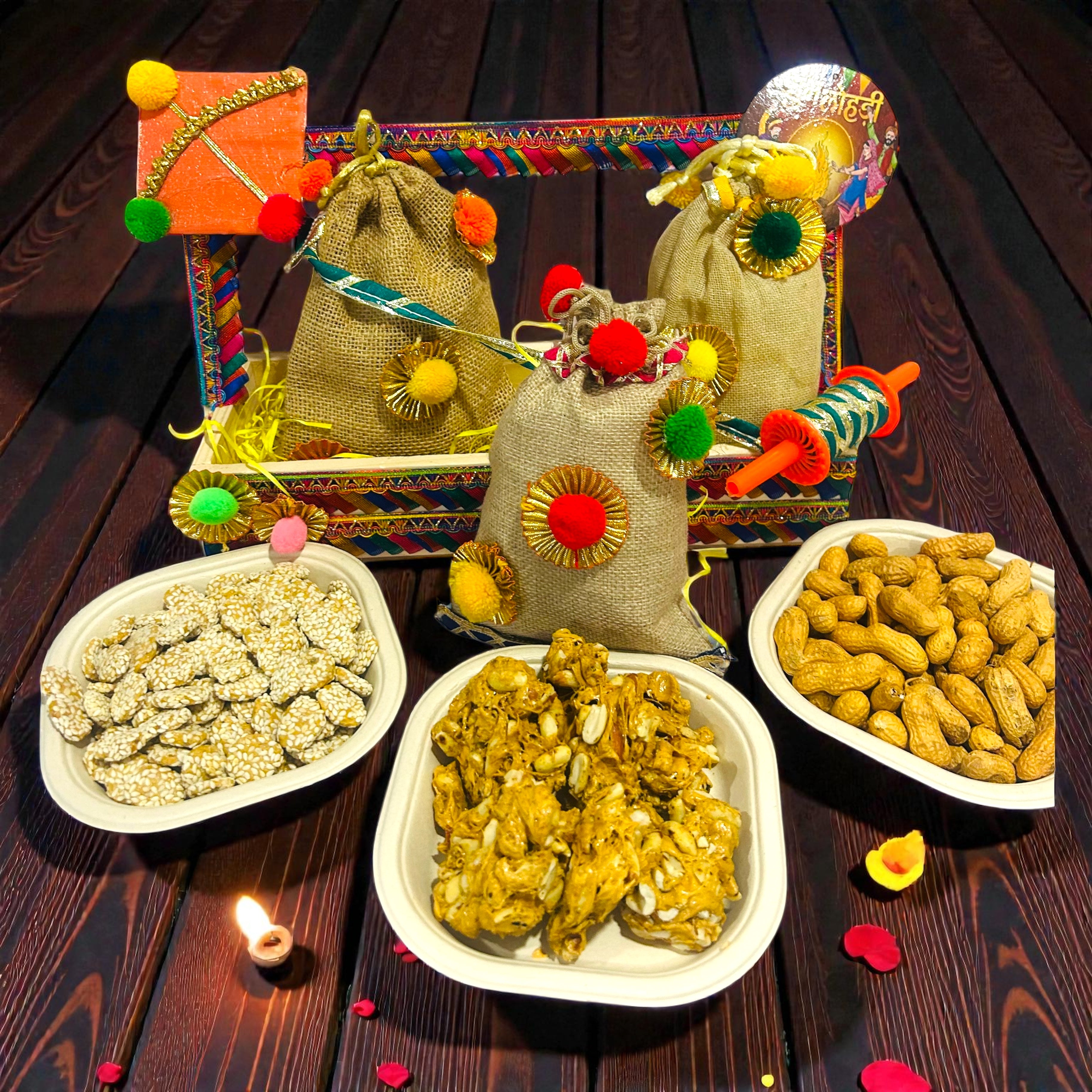 Lohri gift hamper in pine basket with jute potlis of peanut chikki, revdi and moongfali