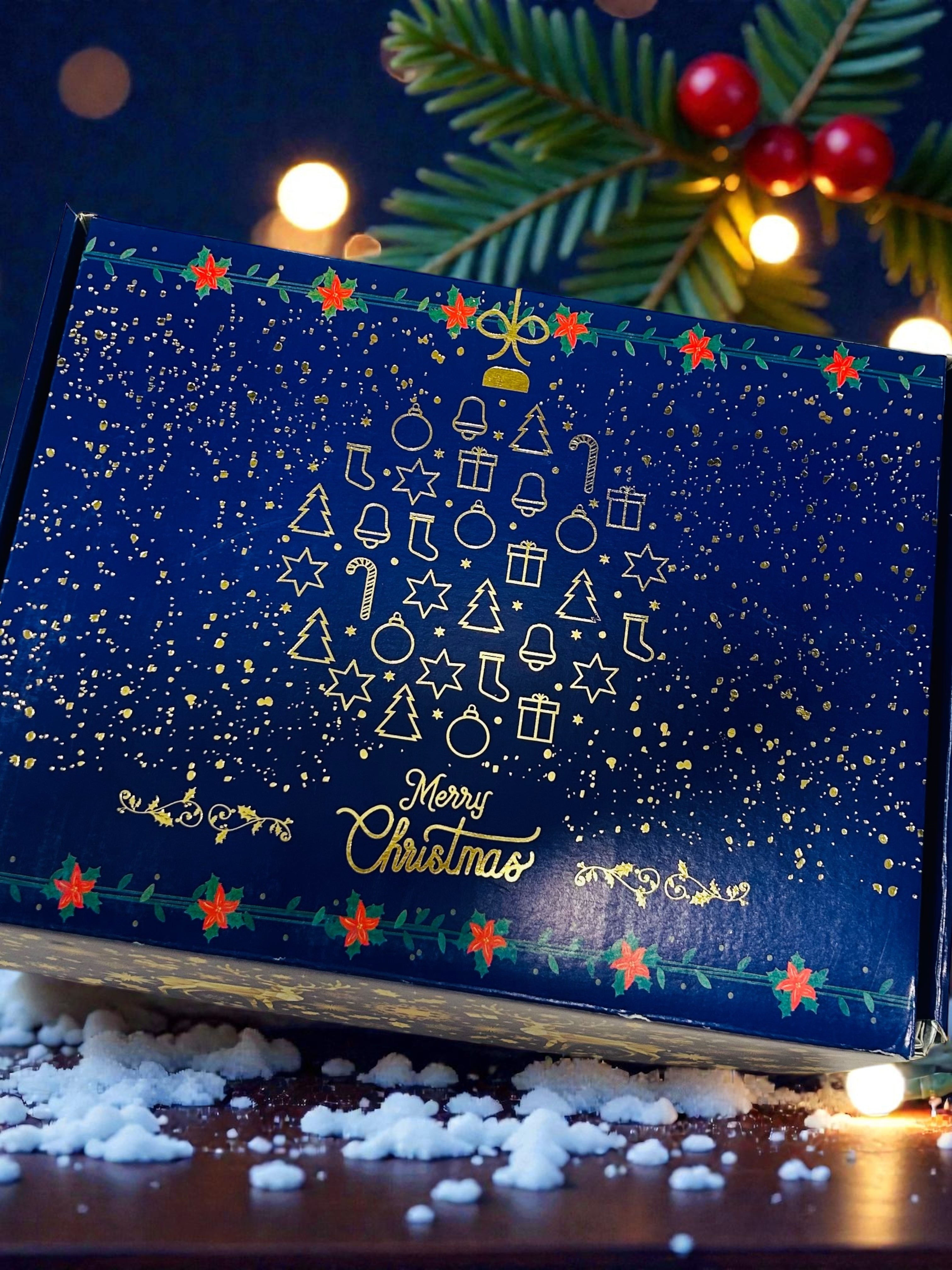 Premium Christmas hamper packed in a Christmas-themed gift box with gourmet treats and décor.