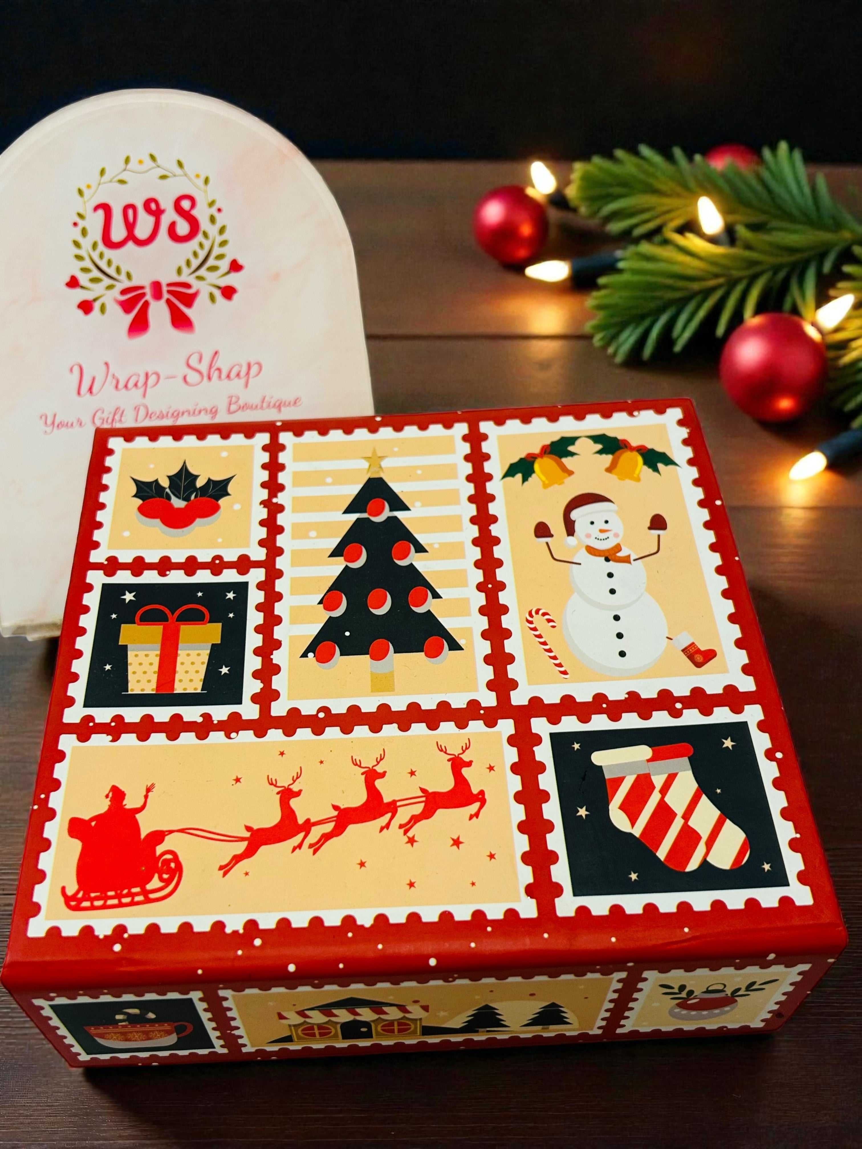 Premium Christmas gift hamper with festive décor, chocolates and mini muffins in magnetic gift box.