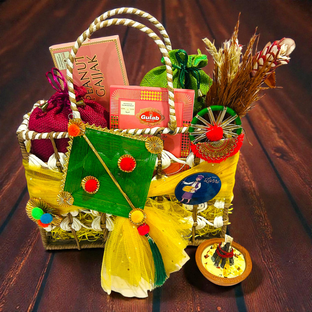 Premium Lohri gift hamper in decorated rafia basket with peanut chikki, gajaks, popcorn and moongfali.