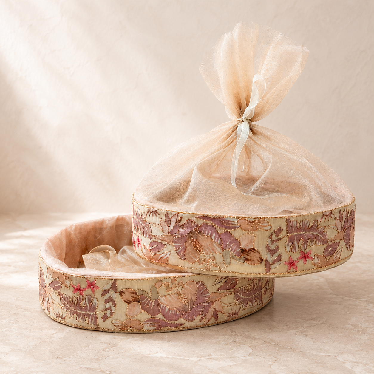 Premium Crafty Oval Gift Basket with decorative net for elegant hamper packaging. Oval MDF gift basket available in 10x13 and 11x15 inch sizes for wedding hampers, festive gifting, and corporate gift packaging