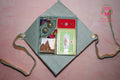 Wrap Shap Premium Rakhi hamper with Ganeshji frame, Kaju Katli sweet box, roli chawal platter and premium AD Rakhi in ethnic gift box