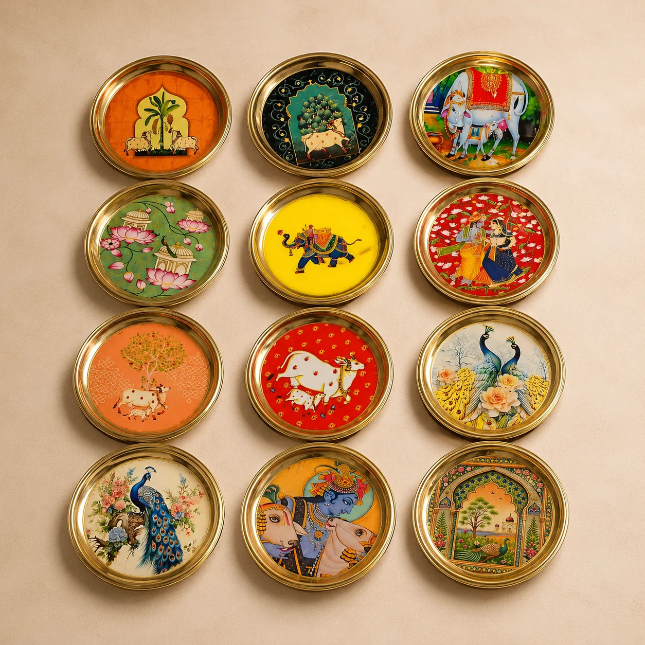 Pure Brass Pichwai Plate by Wrap Shap featuring assorted traditional Pichwai artwork in a 6-inch decorative brass plate, ideal for housewarming gifts, wedding return gifts, festive gifting, pooja décor, and luxury home decoration.