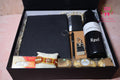 Wrap Shap Rakhi hamper with customized steel bottle, notebook, pen, card holder, keychain, Ferrero Rocher chocolates and Rakhi in rigid gift box