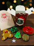 Small Christmas hamper for kids with Christmas cookies and festive doughnut.