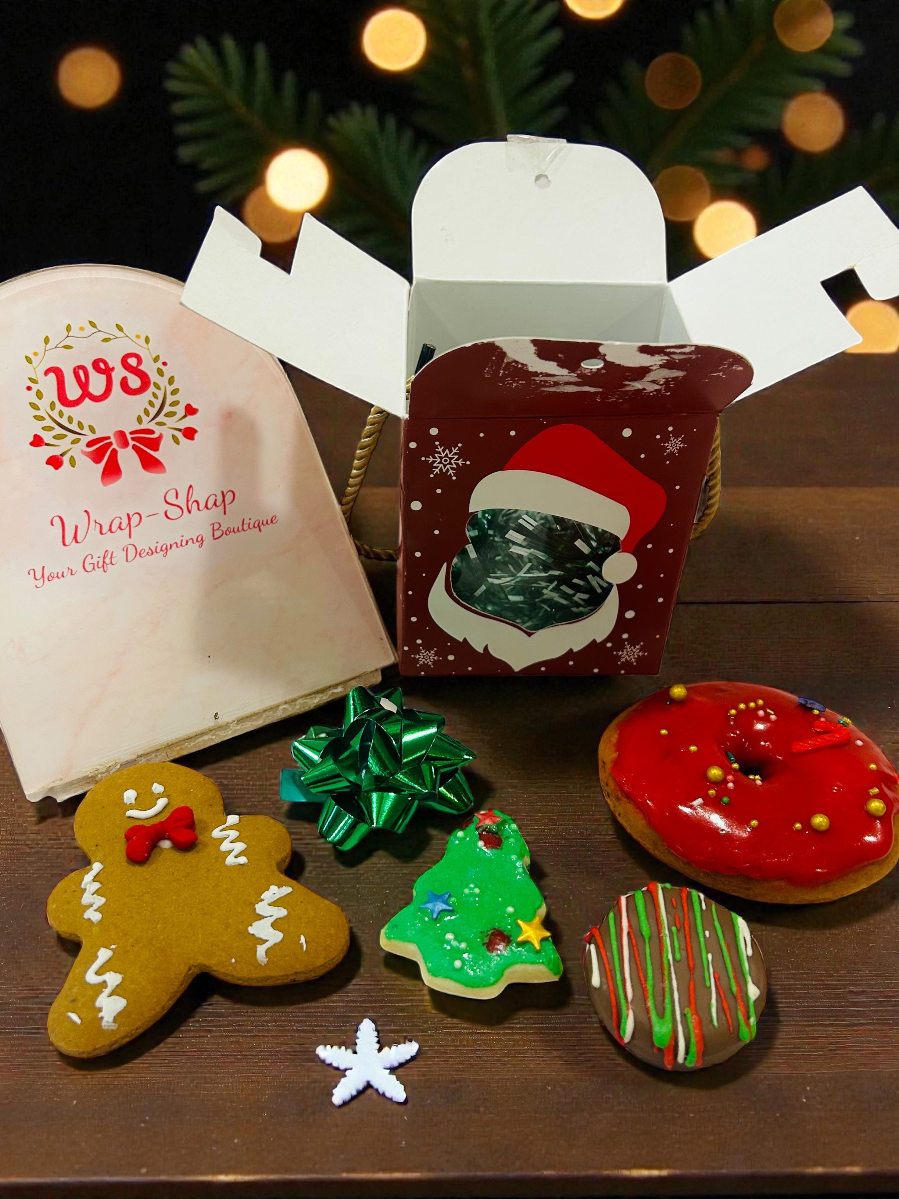 Small Christmas hamper for kids with Christmas cookies and festive doughnut.