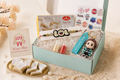 Sweet Surprise Rakhi Box featuring a quirky Rakhi, 100g Kaju Katli, fridge magnet, keychain, greeting card and premium gift box