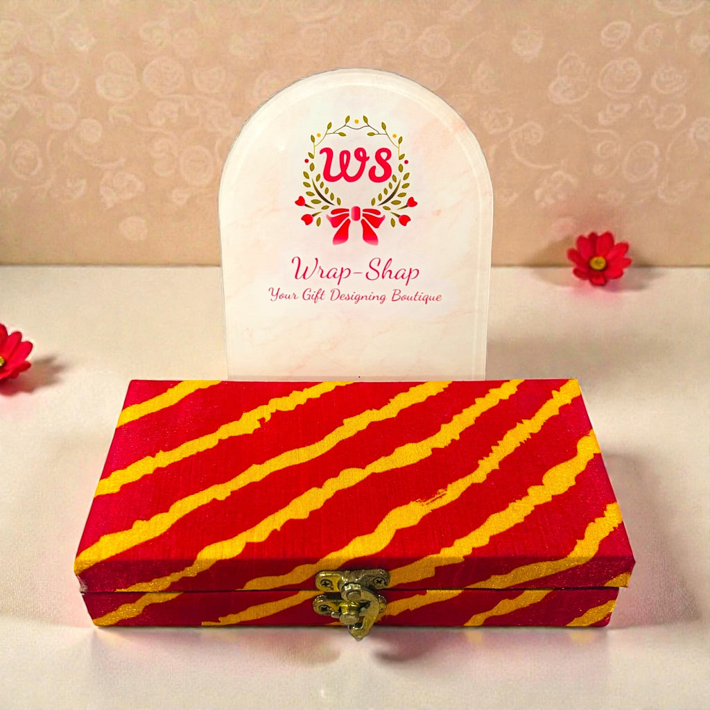 Small wedding return gift box with Ganesh statue, chocolates and scented wax sachet