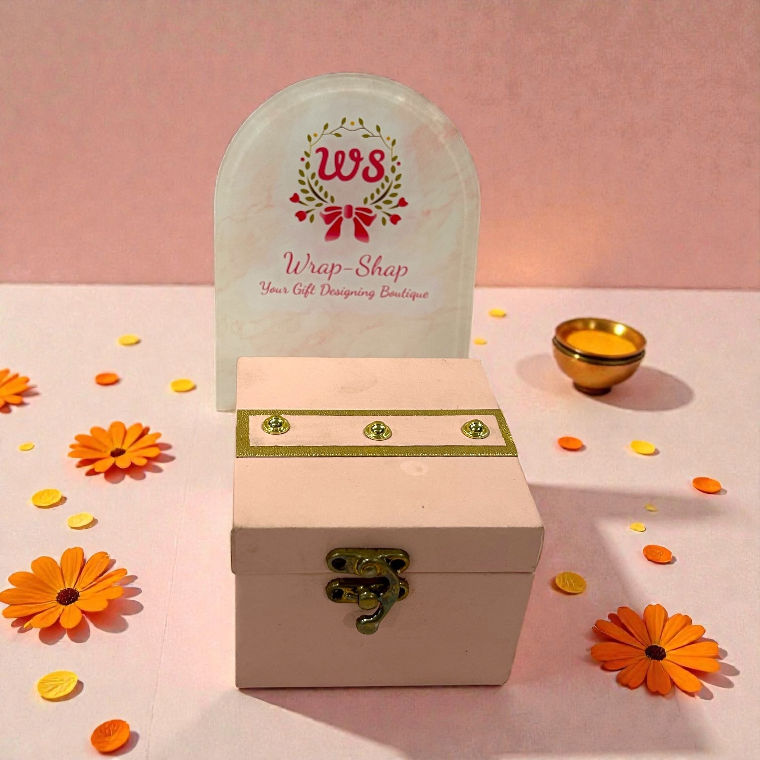 Wedding return gift for ladies featuring bangles, scrunchies and chocolates in premium gift box.