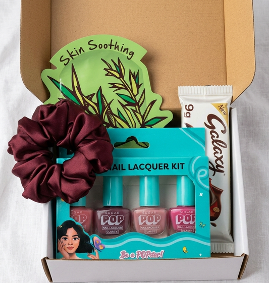 Corporate Women’s Day self care gift hamper with nail paint set, scrunchy, face mask and chocolate for employee gifting