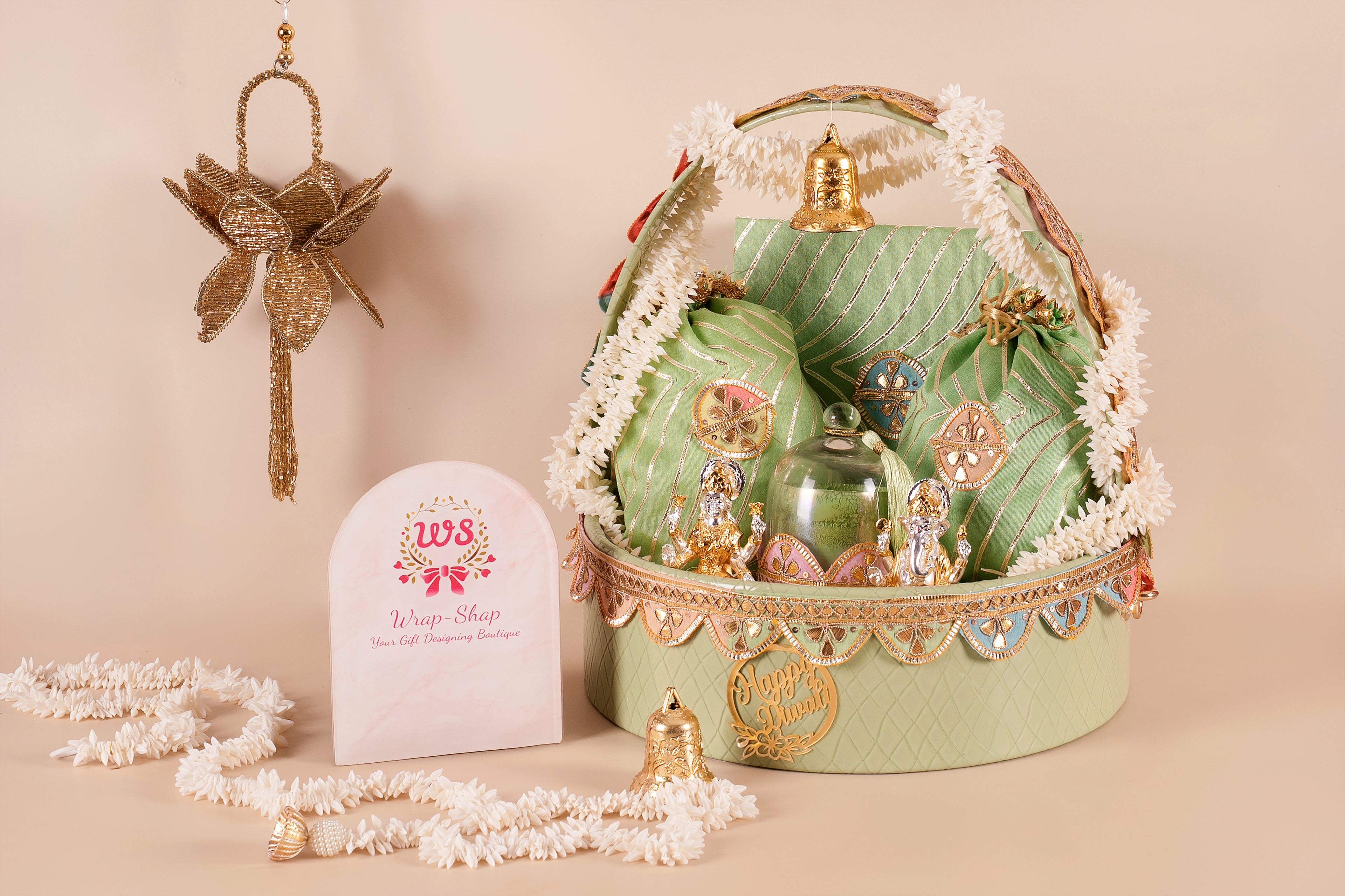 Luxury leather round basket hamper in green leheriya theme with silver finish Laxmi Ganesh idols, scented candle, cashews, almonds & traditional sweets – customizable for Diwali, weddings & corporate gifting.
