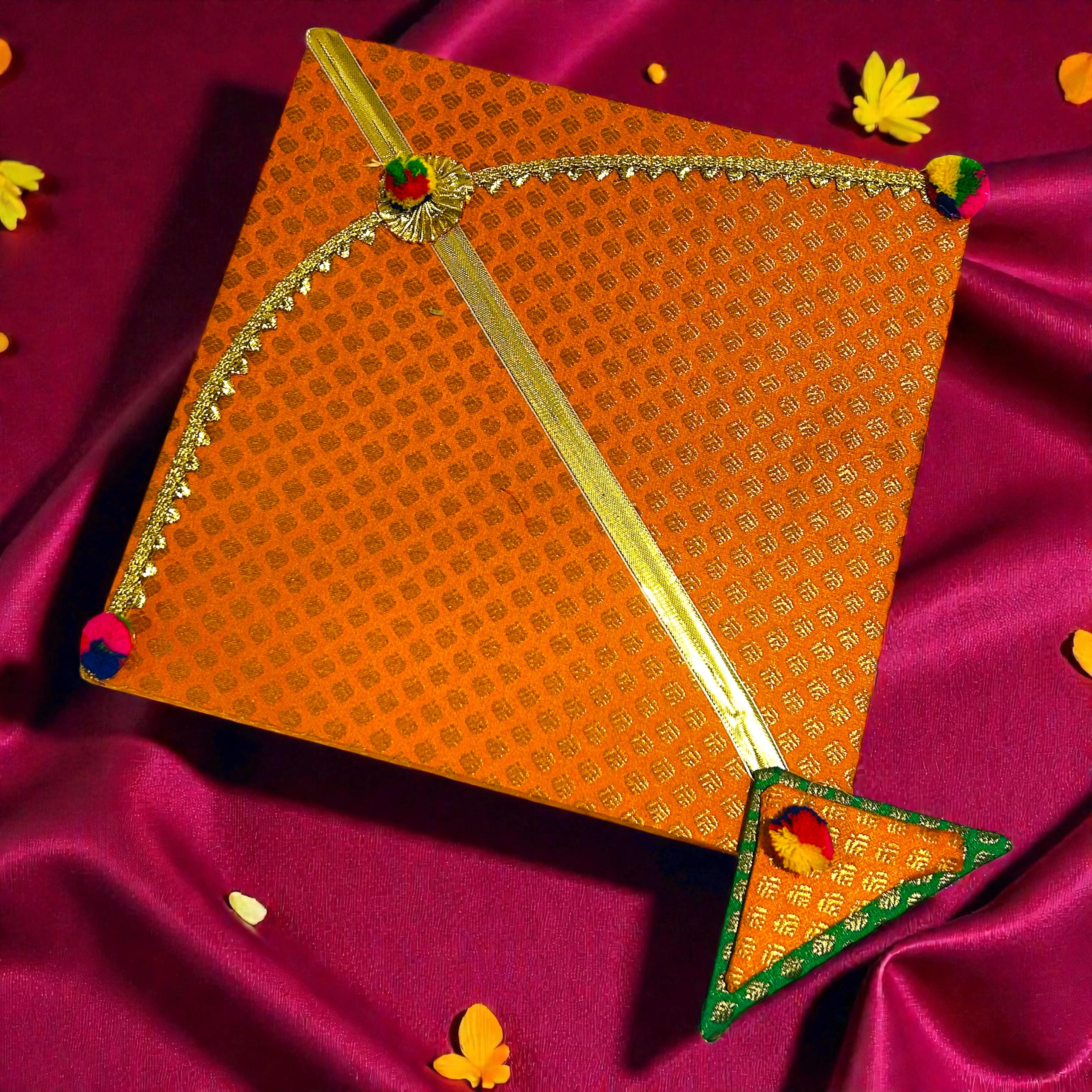Festive Lohri hamper in kite shaped box with traditional snacks and velvet potli.