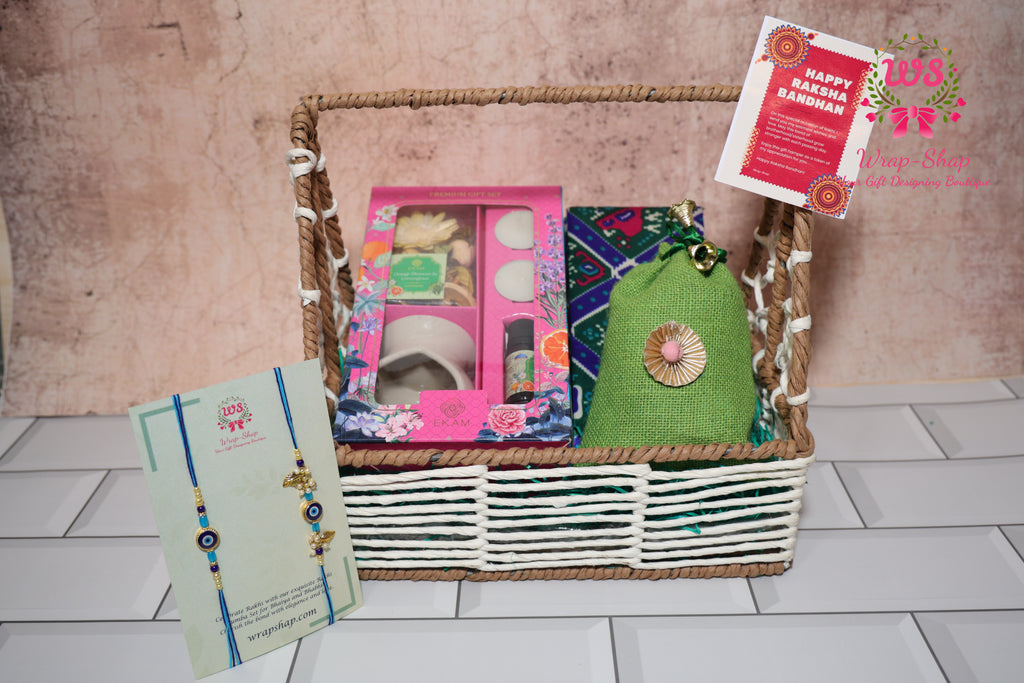 Bhaiya Bhabhi Rakhi gift hamper with diffuser, potpourri, cashews in potli, Rakhi set in jewellery box and rafia basket by Wrap Shap