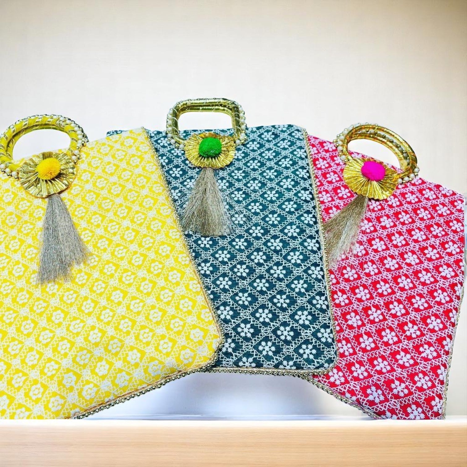 Chikankari embroidery gifting bag with handle in assorted colours by Wrap Shap, perfect for wedding favours and festive small gifts