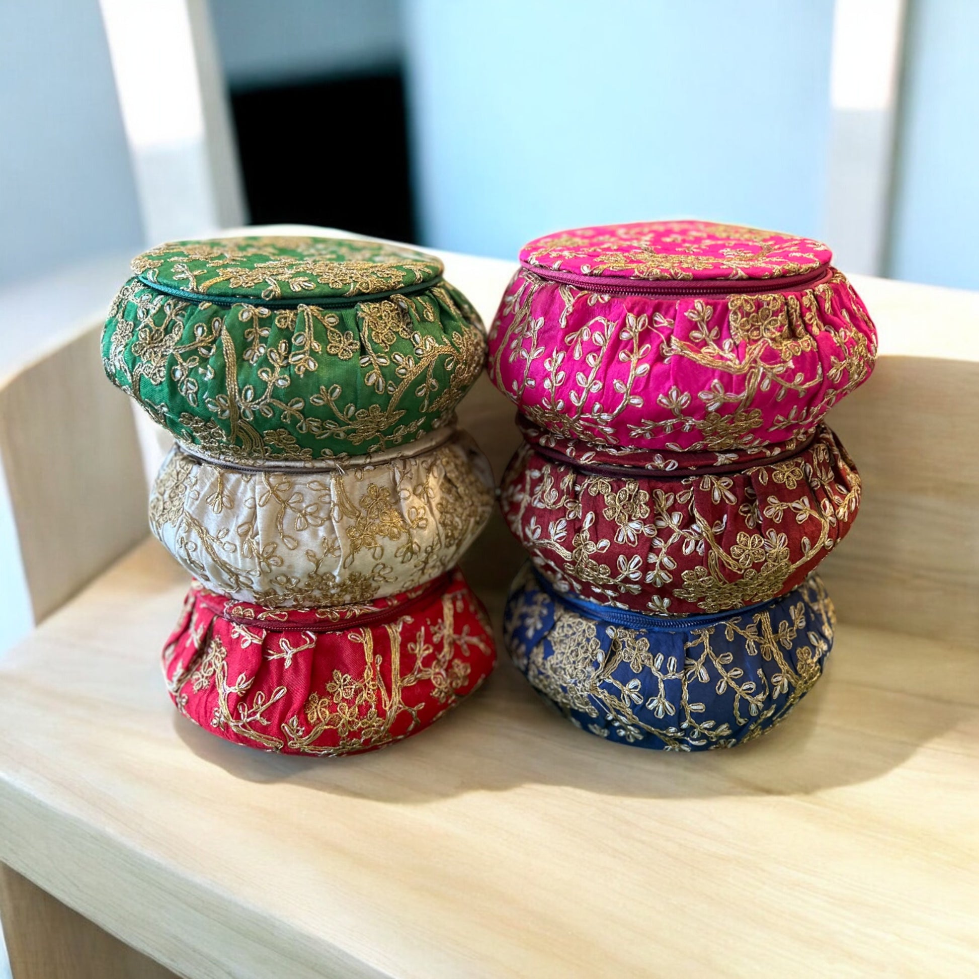 Traditional round matka-shaped gift box with colorful embroidery, ideal for wedding return favours and sweets, by Wrap Shap