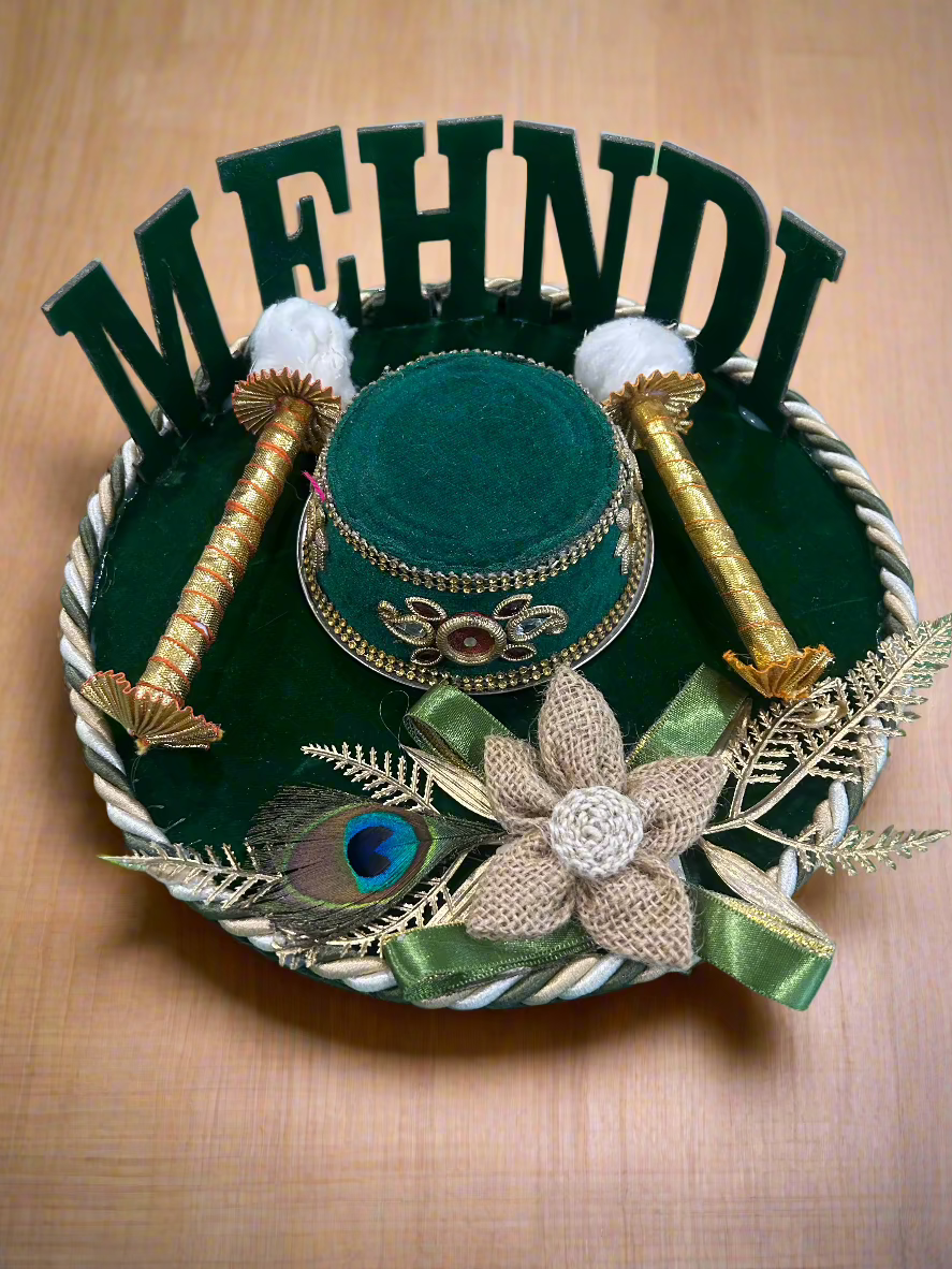Green mehendi platter with 'Mehendi' alphabets, jute morpankh flower, and decorated steel bowl – handcrafted by Wrap Shap for haldi-mehendi ceremonies