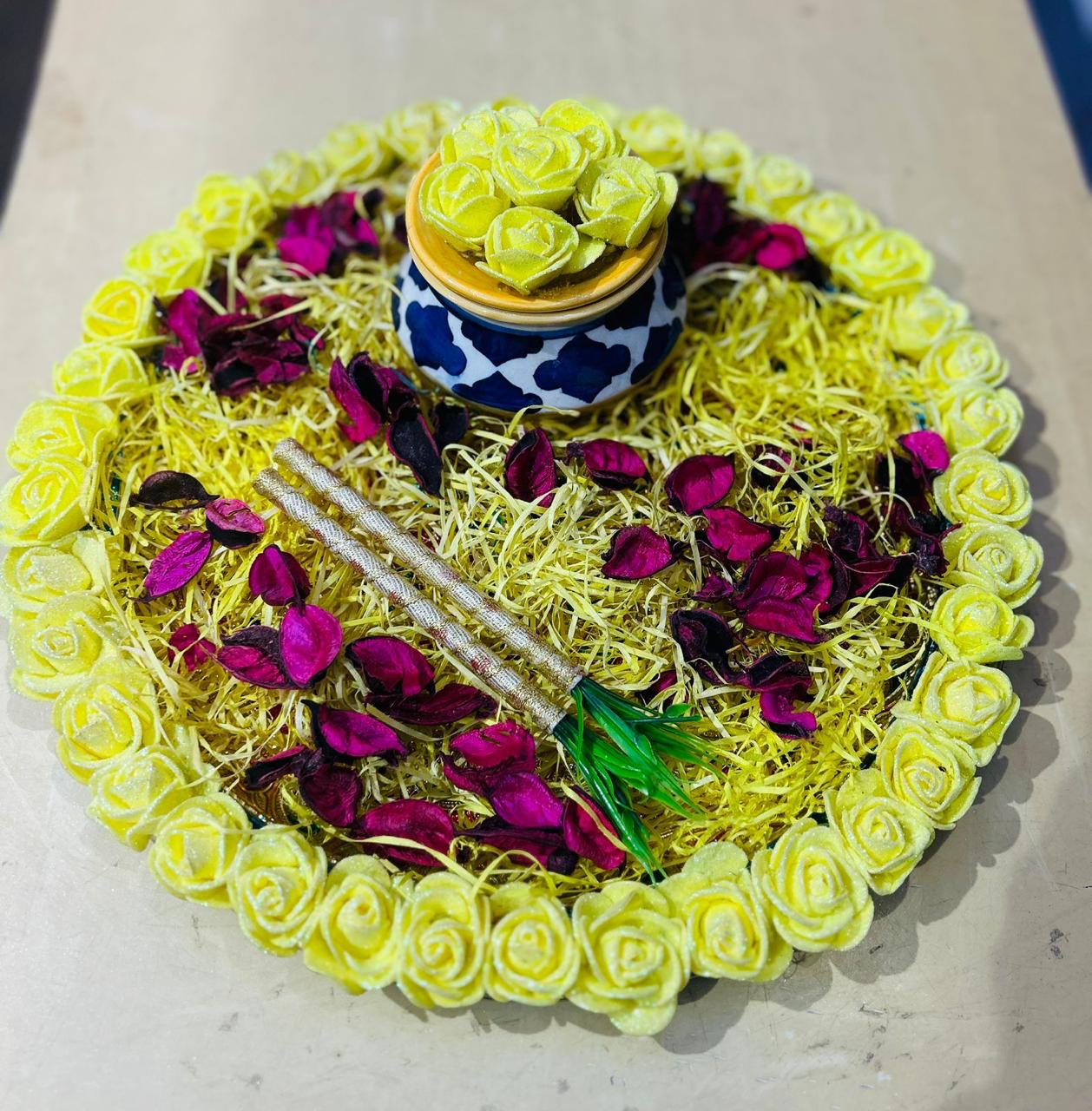 Wrap Shap haldi platter with decorative yellow roses on meenakari tray, includes earthen pot and herbal uptan for wedding rituals