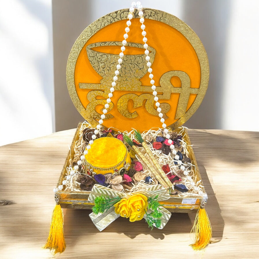Haldi platter in tray with HALDI floral backwall, yellow decorated pot and haldi powder – wedding function tray by Wrap Shap