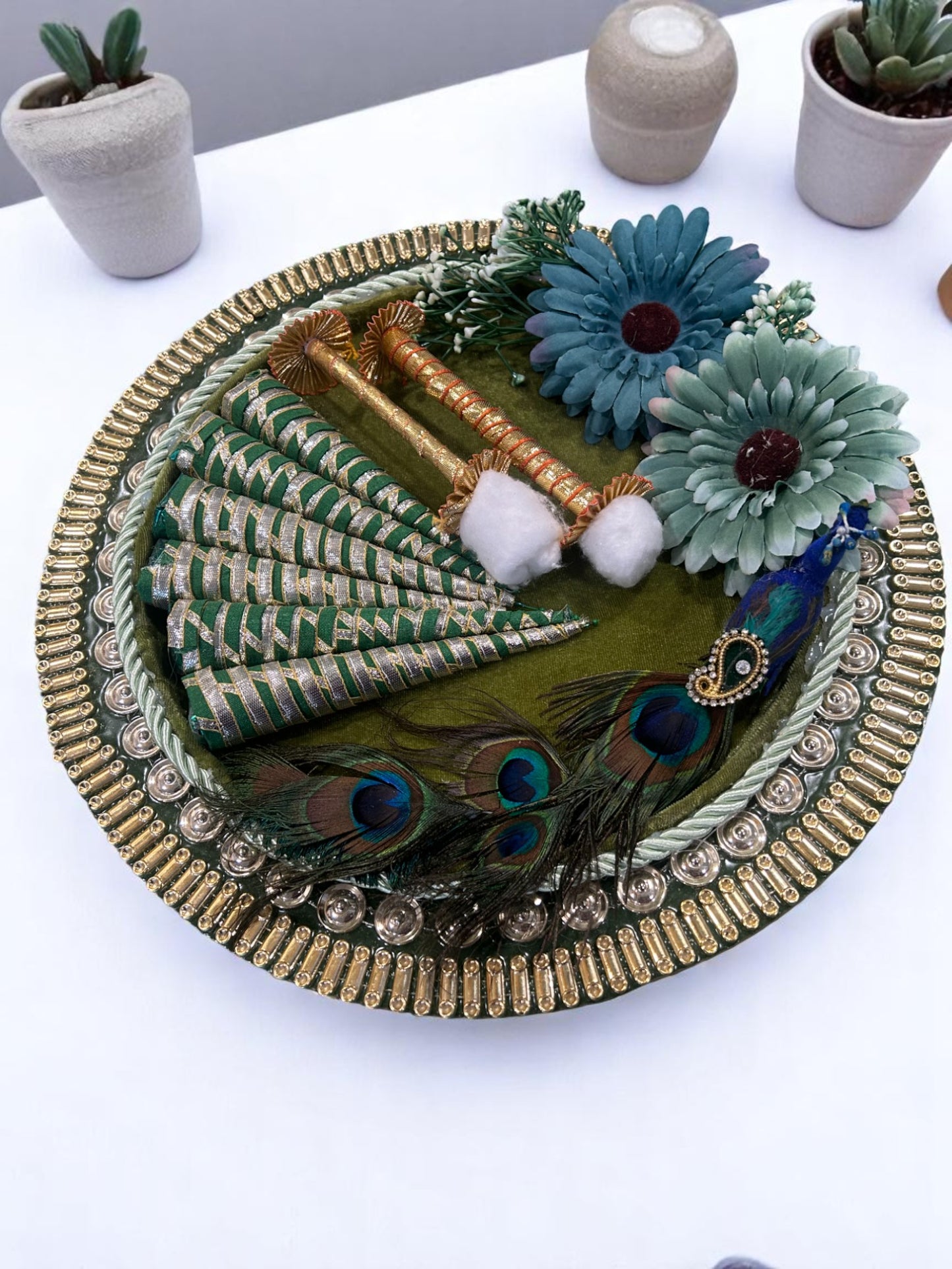 Mehendi platter in round green tray with peacock decor, green-blue flowers and 6 decorated mehendi cones – bridal platter by Wrap Shap