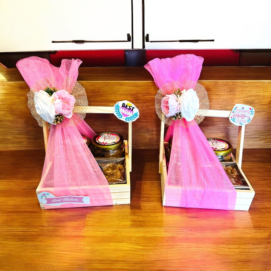 Mother’s Day gift hamper with 2 jars of cookies and a tea cake placed in a decorated basket, customizable with mother’s name by Wrap Shap