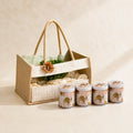 Premium Zippo open tray hamper gift set with four tin jars, artificial plant pot, and reusable Jute PVC carry bag for corporate, wedding, and festive gifting